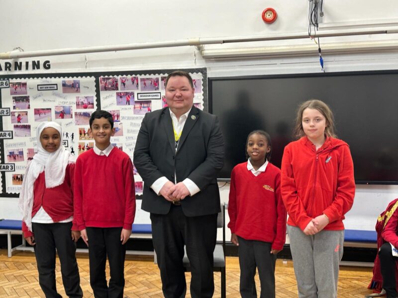 Andrew, with pupils at Seymour Park Community Primary School, in Old Trafford.
